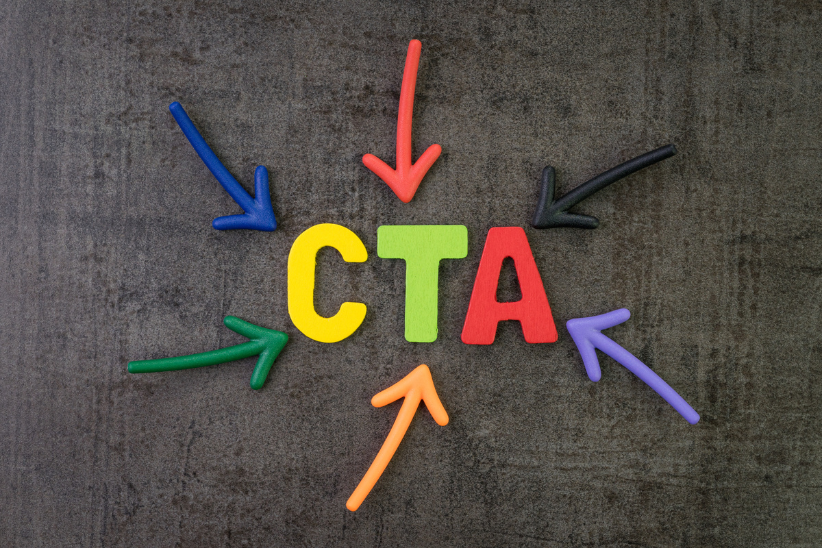 CTA, Call to action in advertising and communication concept, multi color arrows pointing to the word CTA at the center of black cement chalkboard wall
